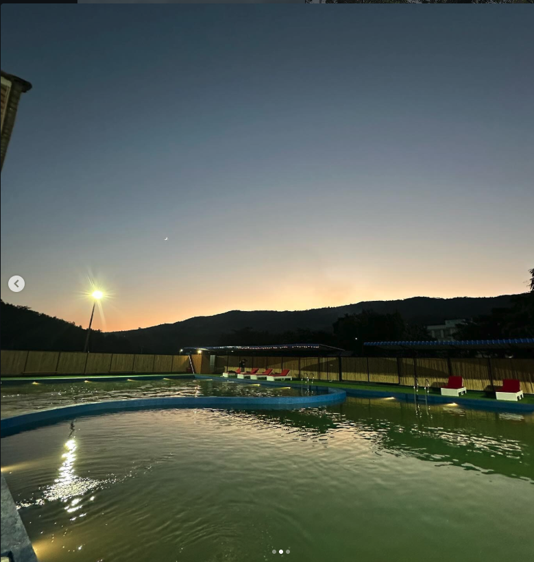 Pool at sunset with hills